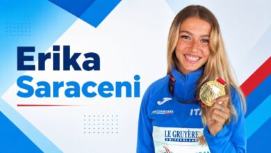 Erika Saraceni holding a gold medal in Italian athletics uniform